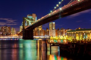 brooklyn-bridge-closeup-east-river-night-new-york-city-manhattan-with-lights-reflections